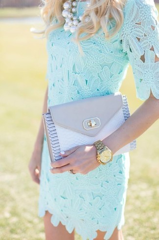 Grey Leather Clutch Outfits: Consider pairing a light blue lace shift dress with a grey leather clutch for a relaxed spin on day-to-day fashion.