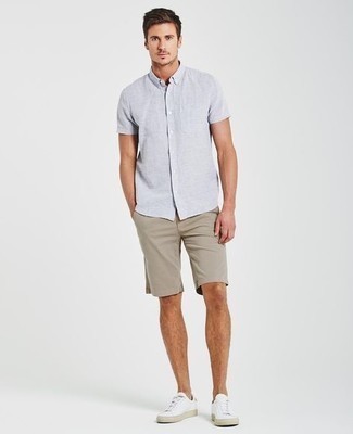 Beige Shorts Outfits For Men: Why not try pairing a light blue short sleeve shirt with beige shorts? As well as super practical, both pieces look nice when combined together. If you're clueless about how to finish, a pair of white canvas low top sneakers is a goofproof option.