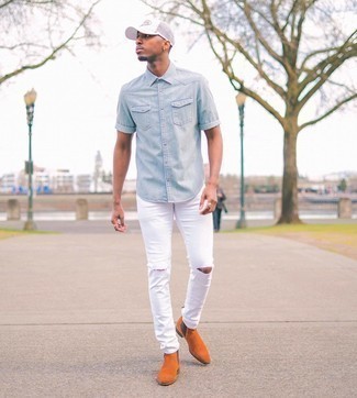 White Print Baseball Cap Outfits For Men: If you gravitate towards casual street style style, why not take this combination of a light blue chambray short sleeve shirt and a white print baseball cap for a spin? Let your sartorial prowess really shine by complementing your look with a pair of tobacco suede chelsea boots.