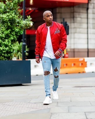 Men's White Canvas Low Top Sneakers, Light Blue Ripped Skinny Jeans, White Crew-neck T-shirt, Red Varsity Jacket