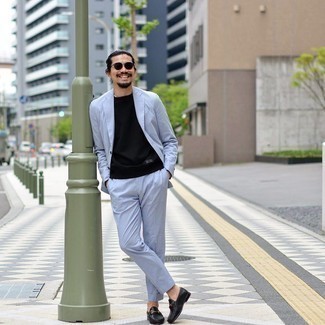 Light Blue Suit Outfits: Consider teaming a light blue suit with a black crew-neck t-shirt if you're aiming for a crisp, on-trend ensemble. Complement this outfit with black leather loafers to completely spice up the getup.