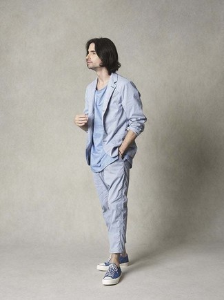 Aquamarine Suit Outfits: You'll be amazed at how very easy it is for any gent to get dressed like this. Just an aquamarine suit worn with a light blue crew-neck t-shirt. Clueless about how to finish? Complete your getup with a pair of navy and white canvas low top sneakers to jazz things up.