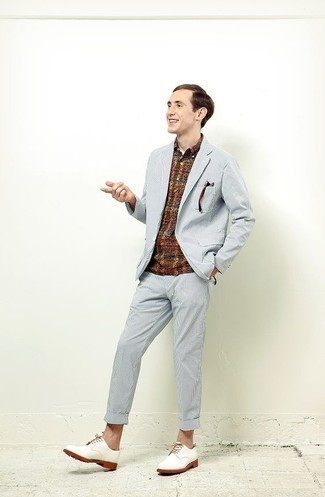 White Leather Derby Shoes Outfits: This pairing of a light blue suit and a multi colored plaid polo oozes sophisticated menswear style. Play down the casualness of this look by rocking a pair of white leather derby shoes.