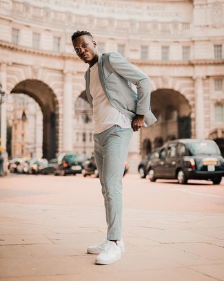 Light Blue Suit Outfits: A light blue suit and a white crew-neck t-shirt are a wonderful combo that will get you a great deal of attention. Send an otherwise standard outfit down a more relaxed path by wearing a pair of white canvas low top sneakers.