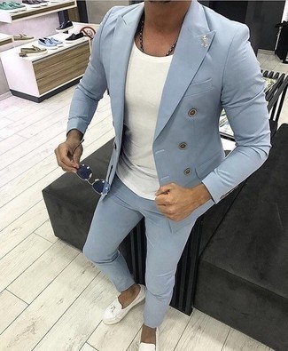 White and Black Leather Tassel Loafers Outfits: We're loving the way this smart combo of a light blue suit and a white crew-neck t-shirt instantly makes any man look dapper. And if you need to instantly dress up your ensemble with one item, add a pair of white and black leather tassel loafers to the mix.