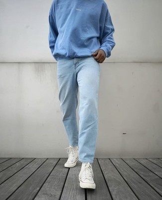 Light Blue Jeans Outfits For Men: A resounding yes to this off-duty combination of a light blue sweatshirt and light blue jeans! Throw white canvas high top sneakers into the mix to give a hint of stylish casualness to this outfit.