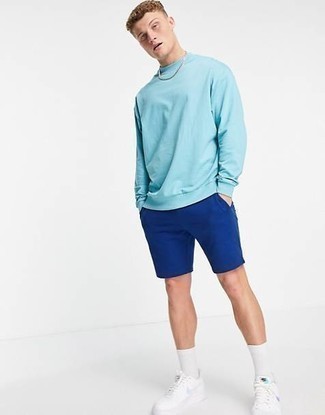 Navy Sports Shorts Outfits For Men: Consider teaming a light blue sweatshirt with navy sports shorts to achieve an interesting and contemporary ensemble. Introduce a pair of white leather low top sneakers to the mix to easily step up the classy factor of your outfit.