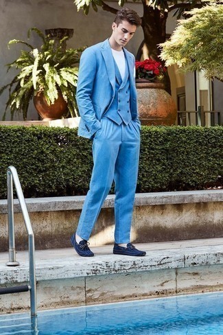 Light Blue Three Piece Suit Outfits: Teaming a light blue three piece suit with a white crew-neck t-shirt is a good choice for a casually smart outfit. Does this outfit feel too polished? Introduce a pair of navy suede driving shoes to change things up a bit.