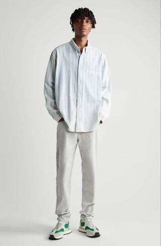 Light Blue Vertical Striped Long Sleeve Shirt Outfits For Men: Wear a light blue vertical striped long sleeve shirt with grey jeans for a laid-back ensemble with a contemporary spin. Complement this outfit with a pair of white and green athletic shoes to make a standard ensemble feel suddenly fun and fresh.