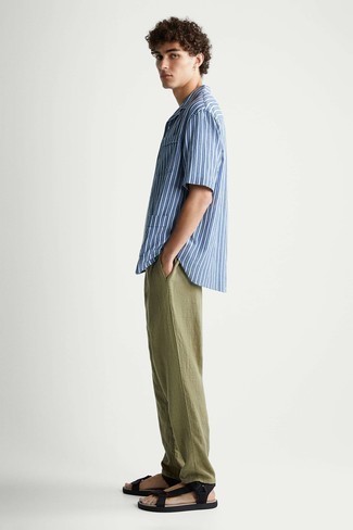 Black Canvas Sandals Outfits For Men: When the situation allows an off-duty look, make a light blue vertical striped short sleeve shirt and olive linen chinos your outfit choice. Go the extra mile and switch up your look with a pair of black canvas sandals.