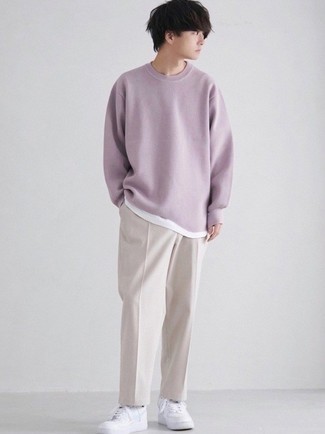 Purple Crew-neck Sweater Outfits For Men: Pair a purple crew-neck sweater with beige chinos to put together an extra sharp and modern-looking off-duty ensemble. For something more on the daring side to finish this ensemble, add white leather low top sneakers to the equation.