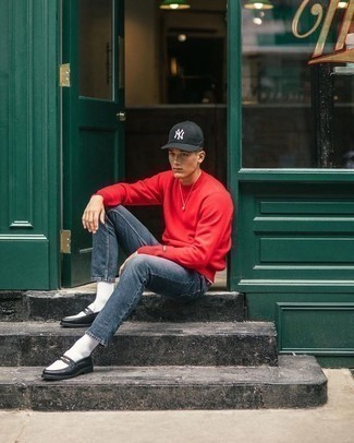 Men's Black and White Print Baseball Cap, Black and White Leather Loafers, Navy Jeans, Red Sweatshirt