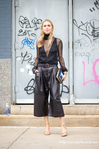 Black Long Sleeve Blouse Outfits: For something more on the cool and casual end, opt for a black long sleeve blouse and black leather culottes. For shoes, you could go down a classier route with a pair of gold leather heeled sandals.