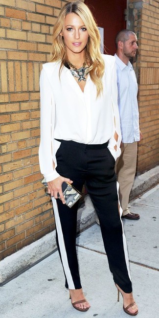 No matter where the day takes you, you can rely on this off-duty pairing of a white cutout long sleeve blouse and black and white skinny pants. For maximum fashion effect, complement this getup with a pair of brown leather heeled sandals.