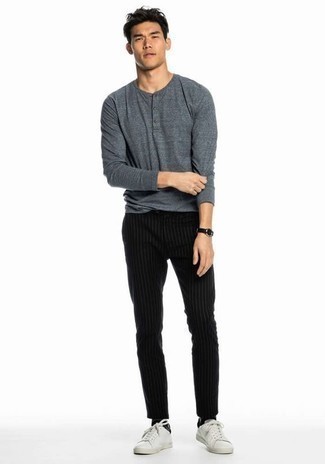 Charcoal Long Sleeve Henley Shirt Outfits For Men: A charcoal long sleeve henley shirt and black vertical striped chinos paired together are a sartorial dream for those dressers who appreciate cool and relaxed getups. If you're wondering how to finish, a pair of white leather low top sneakers is a savvy choice.