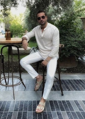 Dark Brown Bracelet Outfits For Men: Consider wearing a white long sleeve henley shirt and a dark brown bracelet for a casual level of dress. Our favorite of a myriad of ways to round off this look is a pair of beige suede sandals.