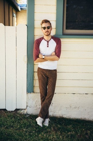 Men's White and Red Long Sleeve Henley Shirt, Brown Jeans, White Canvas High Top Sneakers, Dark Green Sunglasses