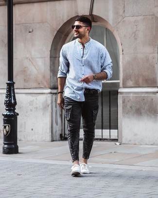 White and Red Vertical Striped Long Sleeve Shirt Outfits For Men: If you're searching for a relaxed casual yet dapper look, go for a white and red vertical striped long sleeve shirt and charcoal cargo pants. Complete your outfit with white canvas low top sneakers for extra fashion points.