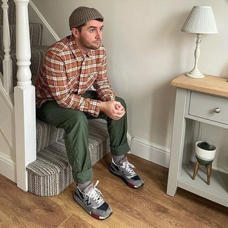 Orange Plaid Long Sleeve Shirt Outfits For Men: Wear an orange plaid long sleeve shirt and dark green chinos for a cool and casual and fashionable outfit. To inject a touch of stylish effortlessness into your look, complete this getup with grey athletic shoes.