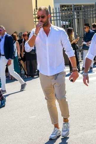 White and Brown Bracelet Outfits For Men: This is irrefutable proof that a white long sleeve shirt and a white and brown bracelet look amazing when matched together in a contemporary ensemble. A pair of grey athletic shoes can integrate perfectly within plenty of ensembles.