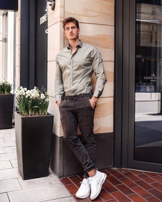 Brown Chinos Summer Outfits: This pairing of an olive long sleeve shirt and brown chinos is extremely versatile and really up for any sort of adventure you may find yourself on. To infuse a dose of stylish effortlessness into your ensemble, complete this getup with white athletic shoes. This look is also great if you're in search of hot weather wear to make a slow day more bearable.