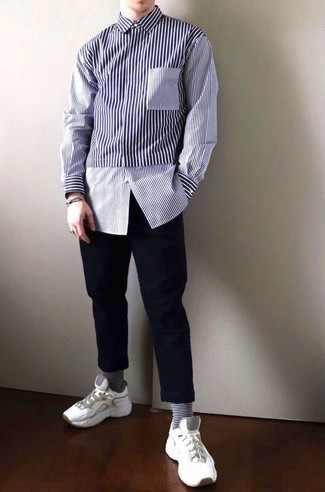Black and White Horizontal Striped Socks Outfits For Men: A white and navy vertical striped long sleeve shirt and black and white horizontal striped socks are a cool combo to add to your current casual collection. Throw in white athletic shoes to take things up a notch.