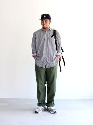 Men's White and Black Vertical Striped Long Sleeve Shirt, Dark Green Chinos, Grey Athletic Shoes, Olive Canvas Backpack