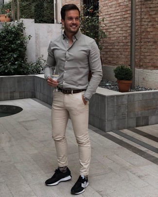Beige Chinos Outfits: This pairing of a mint long sleeve shirt and beige chinos is great for weekend days. Tone down your outfit by slipping into black and white athletic shoes.