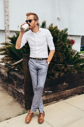 Tobacco Leather Brogues Outfits: Marry a white long sleeve shirt with light blue chinos to achieve an interesting and modern-looking off-duty outfit. Ramp up the appeal of your outfit by finishing with tobacco leather brogues.