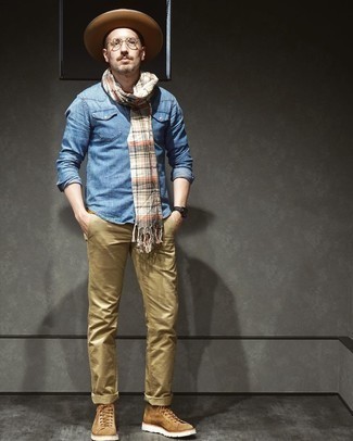 Tan Suede Casual Boots Outfits For Men: Combining a blue chambray long sleeve shirt with khaki chinos is a smart idea for a laid-back and cool outfit. Tap into some David Beckham stylishness and lift up your outfit with a pair of tan suede casual boots.