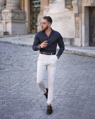 Double Monks Outfits: A navy long sleeve shirt and white chinos are the kind of a tested off-duty getup that you need when you have no time to spare. Infuse this ensemble with some extra elegance by slipping into a pair of double monks.