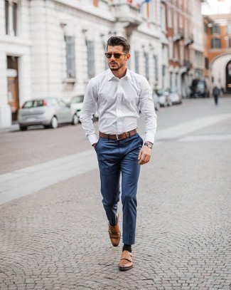 Dark Brown Leather Double Monks Outfits: If it's ease and functionality that you appreciate in menswear, marry a white long sleeve shirt with navy chinos. A pair of dark brown leather double monks will bring a strong and masculine feel to any getup.
