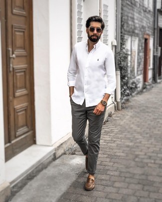 Dark Brown Leather Driving Shoes Outfits For Men: Look sharp yet casual in a white long sleeve shirt and charcoal chinos. If you're on the fence about how to round off, add a pair of dark brown leather driving shoes.