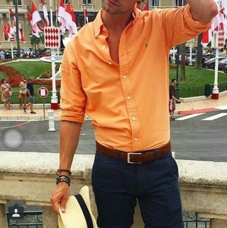 Orange Long Sleeve Shirt Outfits For Men: Pairing an orange long sleeve shirt with black chinos is an awesome option for a casual but sharp outfit.