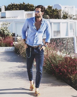 Brown Print Leather Belt Outfits For Men: The formula for a killer relaxed casual getup? A light blue linen long sleeve shirt with a brown print leather belt. Introduce multi colored print canvas loafers to this outfit for an instant style injection.