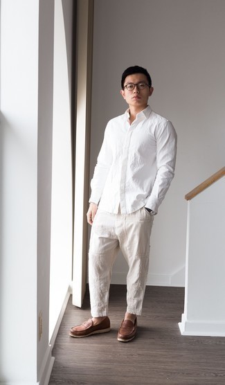 Khaki Embroidered Chinos Outfits: Inject style into your daily casual lineup with a white long sleeve shirt and khaki embroidered chinos. Feeling adventerous? Spruce up this ensemble with a pair of brown leather loafers.