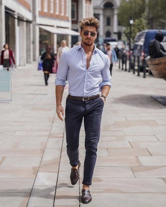 Dark Brown Leather Loafers Outfits For Men: To create a relaxed look with a fashionable spin, wear a white and blue vertical striped long sleeve shirt with navy chinos. Throw a pair of dark brown leather loafers into the mix to avoid looking too casual.