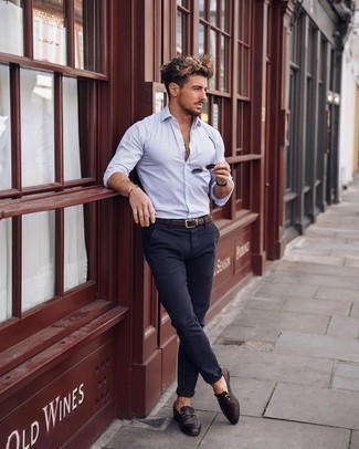 Dark Brown Leather Loafers Outfits For Men: Make a white and blue vertical striped long sleeve shirt and navy chinos your outfit choice to create an interesting and current casual ensemble. Go ahead and complement this outfit with dark brown leather loafers for a sense of sophistication.