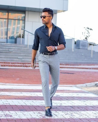 Navy Leather Loafers Outfits For Men: Fashionable and comfortable, this off-duty combination of a navy long sleeve shirt and grey chinos will provide you with ample styling opportunities. Add a pair of navy leather loafers to this outfit to easily turn up the fashion factor of this outfit.