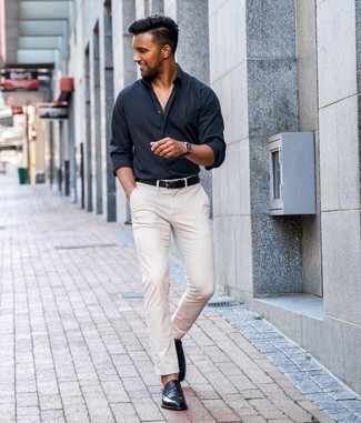 Navy Leather Loafers Outfits For Men: This combo of a navy long sleeve shirt and white chinos is indisputable proof that a simple casual ensemble doesn't have to be boring. Here's how to play it up: navy leather loafers.