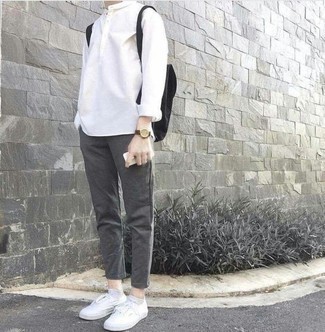 Black Canvas Backpack Outfits For Men: Why not go for a white long sleeve shirt and a black canvas backpack? These two items are totally comfortable and will look great worn together. Why not take a classic approach with footwear and complement this look with white canvas low top sneakers?