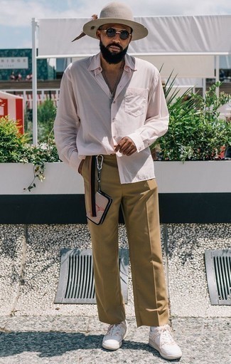 Beige Wool Hat Outfits For Men: A pink long sleeve shirt and a beige wool hat are among the key items in any gentleman's great off-duty closet. If you need to easily perk up this ensemble with one single piece, why not complement your look with a pair of white leather low top sneakers?