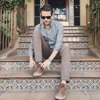 Brown Suede Low Top Sneakers Outfits For Men: This off-duty combination of a light blue long sleeve shirt and brown chinos is a surefire option when you need to look sharp in a flash. Feeling inventive today? Shake up this look by finishing with brown suede low top sneakers.
