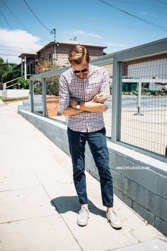Multi colored Plaid Long Sleeve Shirt Outfits For Men: Marrying a multi colored plaid long sleeve shirt with navy chinos is a good pick for a casually stylish outfit. Complement this look with white canvas low top sneakers and off you go looking killer.