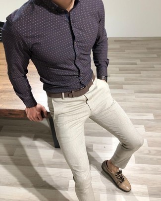 Navy Polka Dot Long Sleeve Shirt Outfits For Men: Try teaming a navy polka dot long sleeve shirt with grey chinos to create a cool and relaxed look. Our favorite of an infinite number of ways to finish this getup is with beige suede low top sneakers.