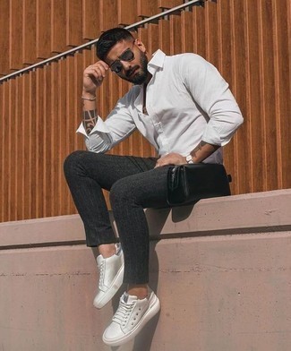 Grey Vertical Striped Chinos Outfits: If it's comfort and practicality that you're seeking in menswear, opt for a white long sleeve shirt and grey vertical striped chinos. Let your outfit coordination prowess really shine by completing this look with white leather low top sneakers.
