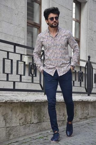 Navy Leather Low Top Sneakers Outfits For Men: For a goofproof laid-back option, you can't go wrong with this combination of a multi colored floral long sleeve shirt and navy chinos. A pair of navy leather low top sneakers will be a welcome companion to your ensemble.