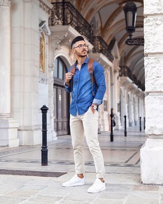 Blue Long Sleeve Shirt Outfits For Men: This combo of a blue long sleeve shirt and white chinos is a safe go-to for an utterly stylish look. If you want to immediately dial down this look with one single item, why not finish with white canvas low top sneakers?