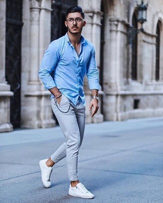 Blue Bracelet Outfits For Men: A light blue long sleeve shirt and a blue bracelet will give off a carefree, cool-kid vibe. White canvas low top sneakers will bring a dash of sophistication to an otherwise mostly dressed-down look.