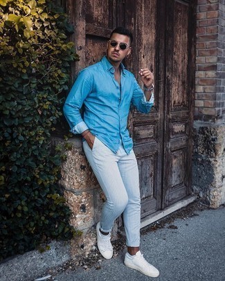 Men's Aquamarine Chambray Long Sleeve Shirt, White Vertical Striped Chinos, White Canvas Low Top Sneakers, Black Sunglasses